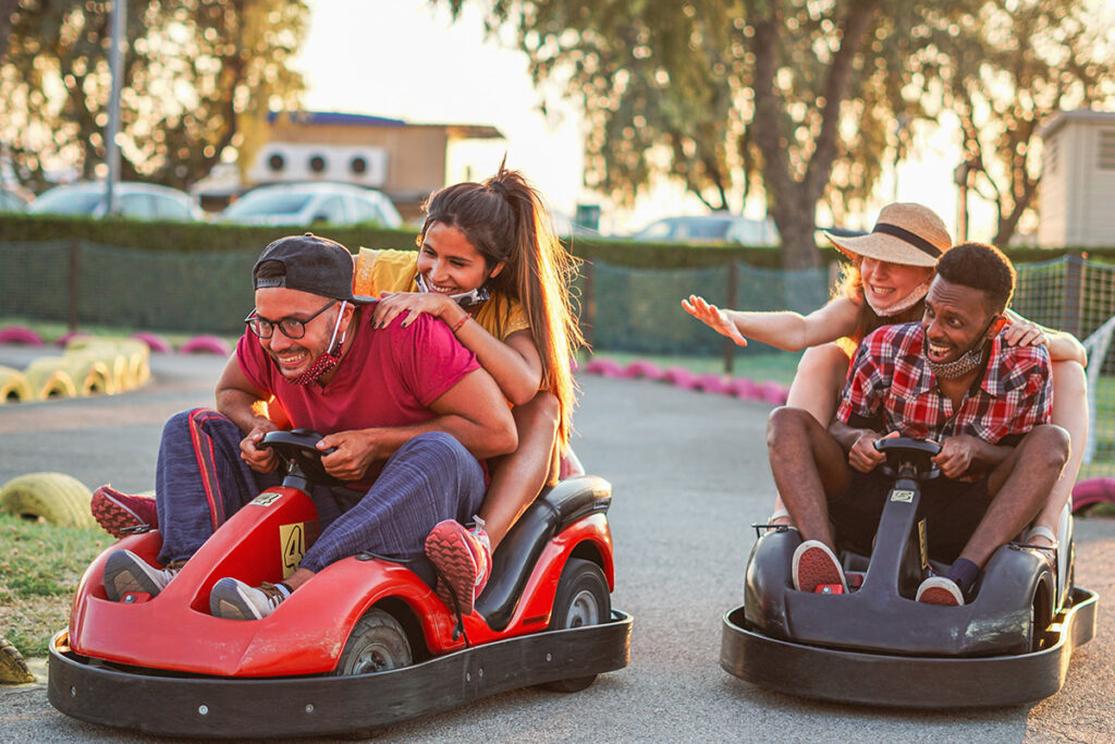 Group of friends riding go karts.